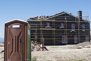 porta potty on a new home construction site